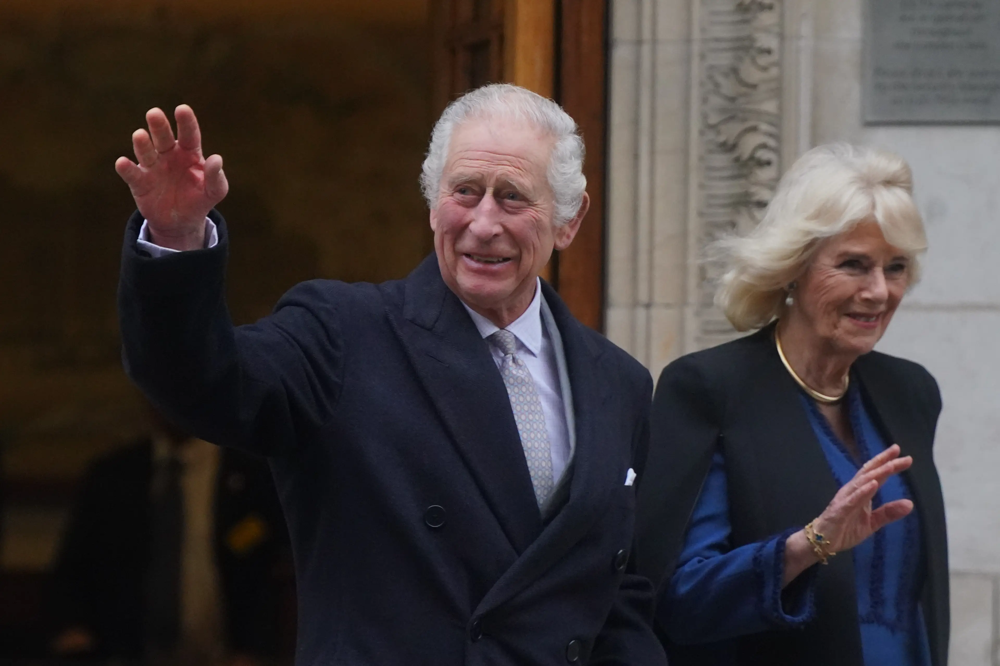 King Charles with Queen Camilla in January last year (PA)