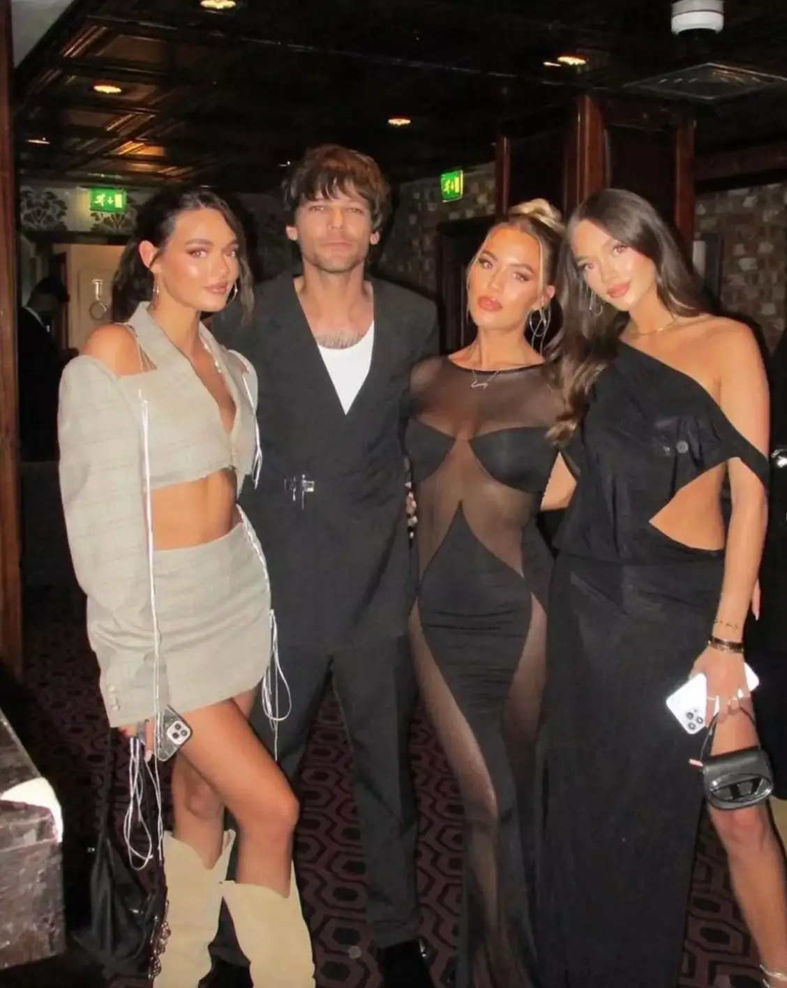 Phoebe with her siblings, including former One Direction member Louis.