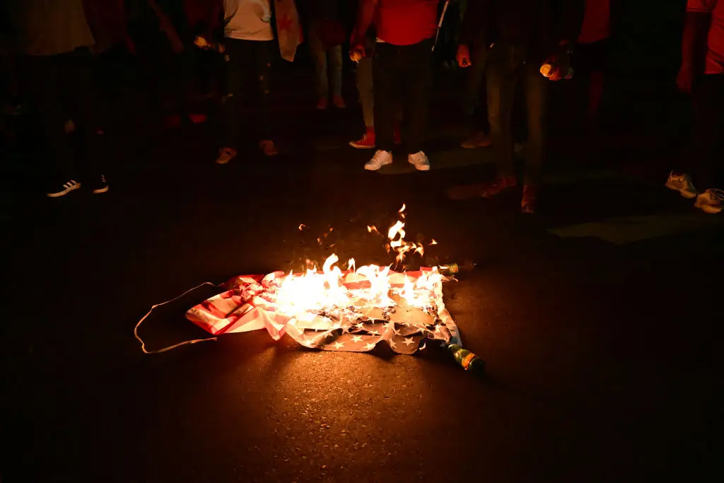 The order follows months of protesters burning American flags at various anti-Israel and anti-ICE demonstrations (MARTIN BERNETTI / Contributor / Getty Images)