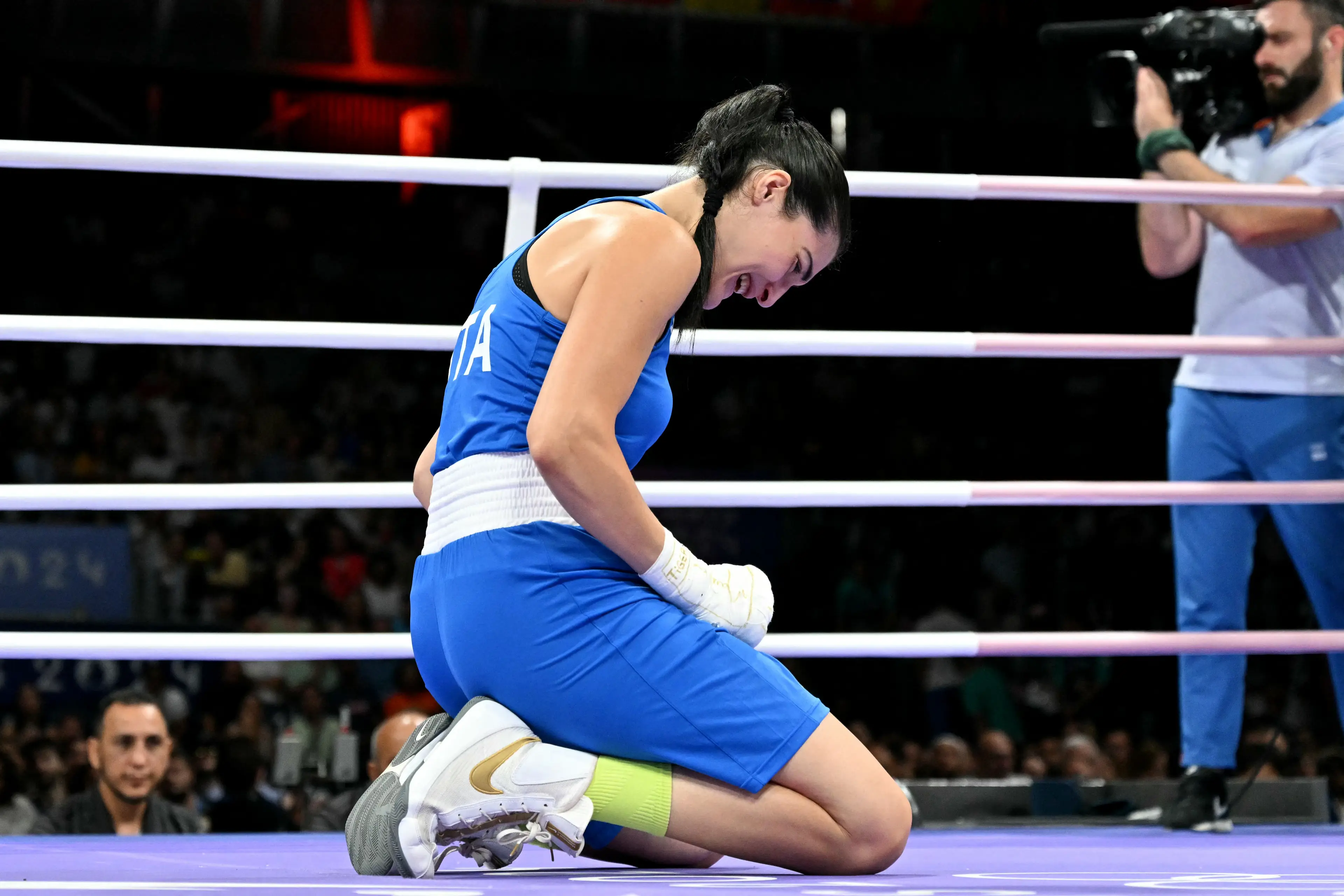 Italy's Angela Carini broke down in tears on the canvas after calling off the bout (MOHD RASFAN/AFP via Getty Images)