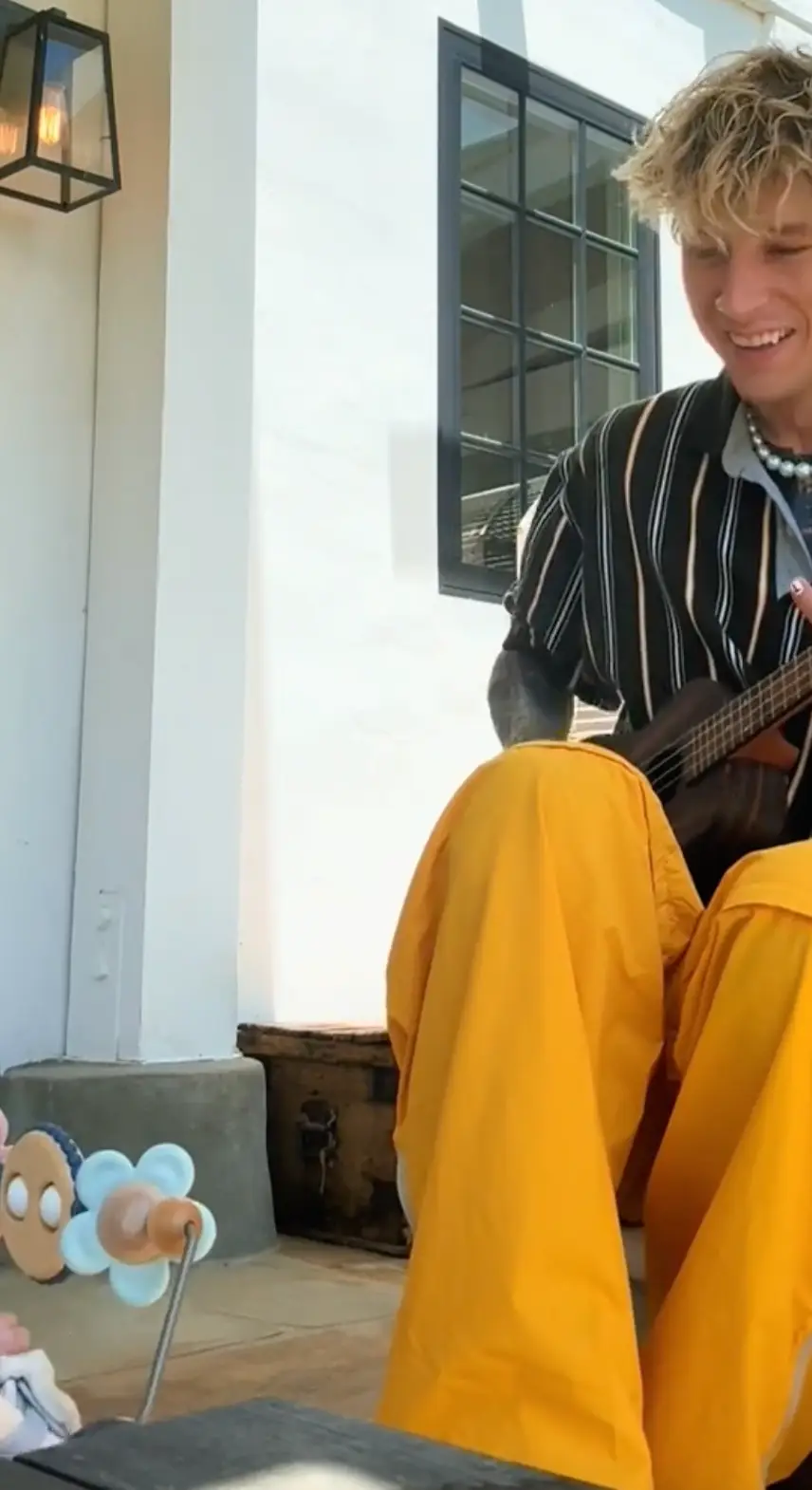 MGK can be seen playing the ukulele in the video (Instagram/@machinegunkelly)
