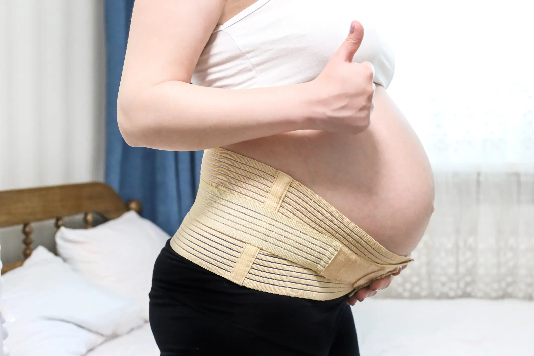 A belly support band or belt may help with the pain (Natalya Trofimchuk / Getty Images)