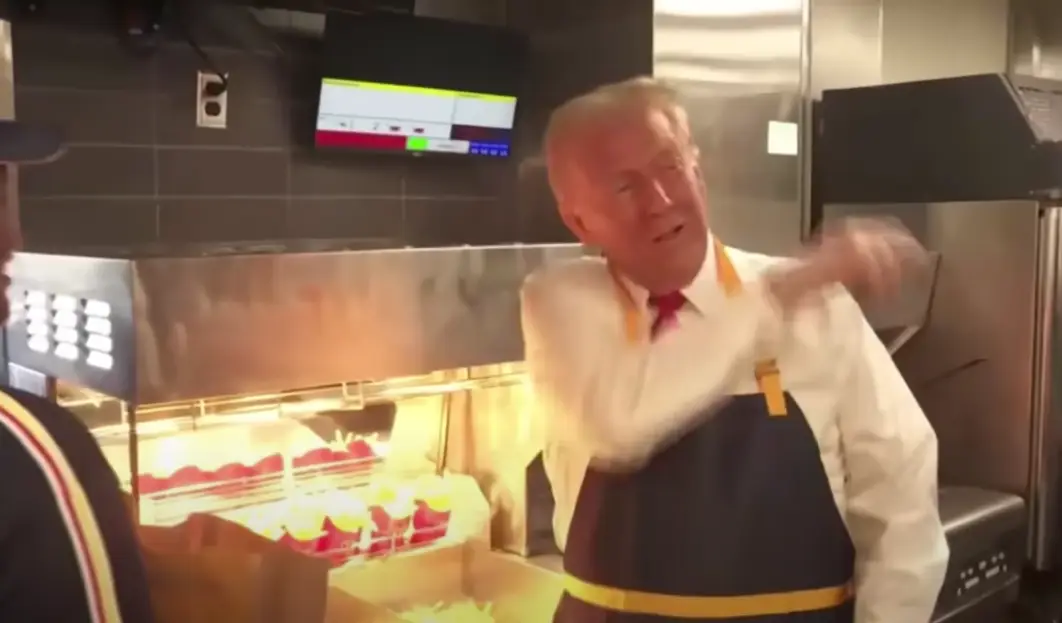 Trumpo throwing salt over his shoulder at a Pennsylvania McDonald's while campaigning last year (Sky News Australia)