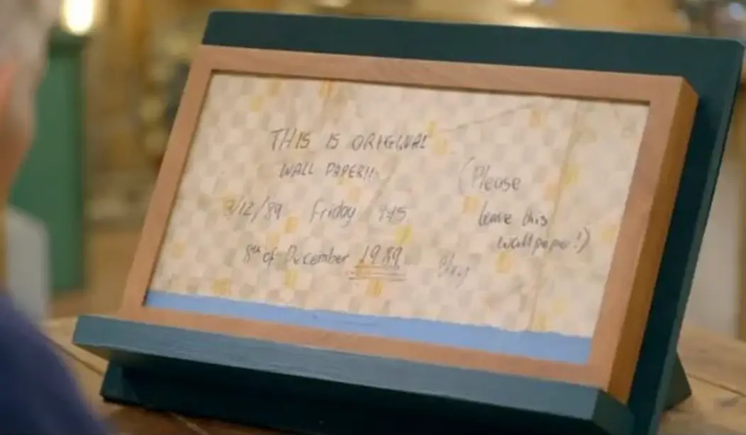 The couple discovered a 'secret message' behind their wallpaper (BBC)