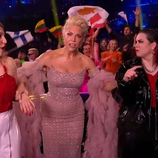 The presenter swapped purple for pink during the competition's Grand Finale.