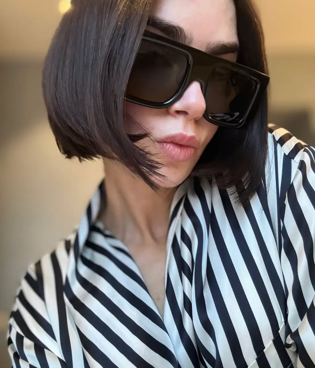 Lily Collins fans are only just realising who her famous dad is (Instagram/@lilyjcollins)