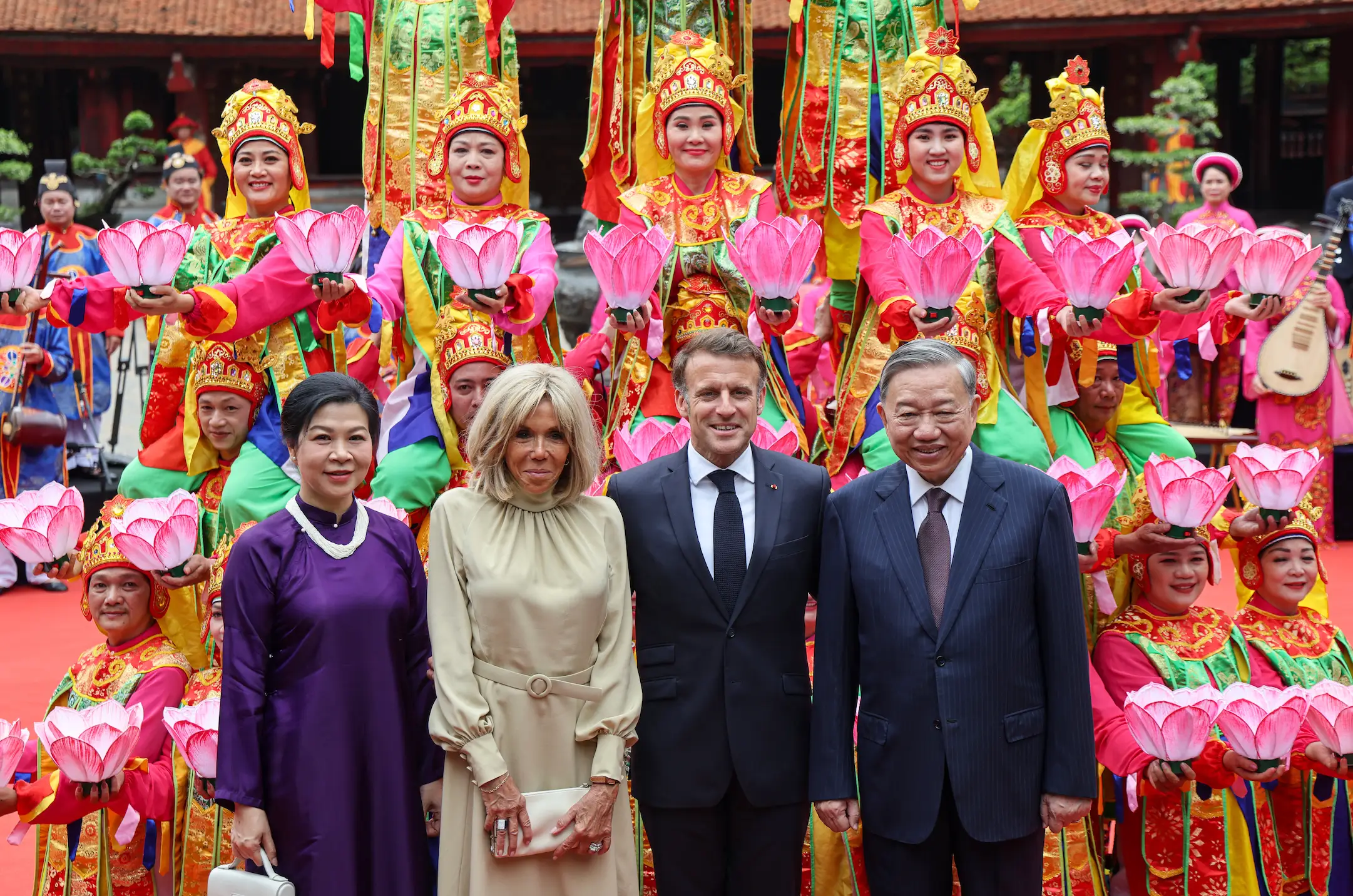 Emmanuel and Brigitte Macron with Vietnam's General Secretary of the Communist Party To Lam and his wife Ngo Phuong Ly in Hanoi (LUDOVIC MARIN/AFP via Getty Images)