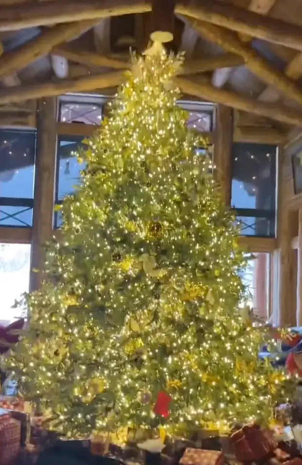 Carey's kids then wake her up and they open presents.