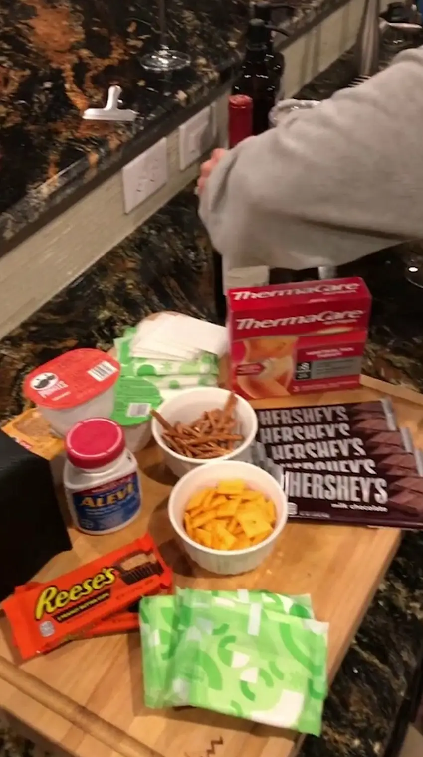 The 'period boards' include sanitary products, chocolates, crisps, tissues and painkillers.