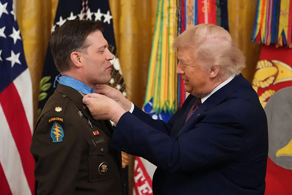 Trump apparently struggled to clasp the medal's ribbon (Photo by Andrew Harnik/Getty Images)