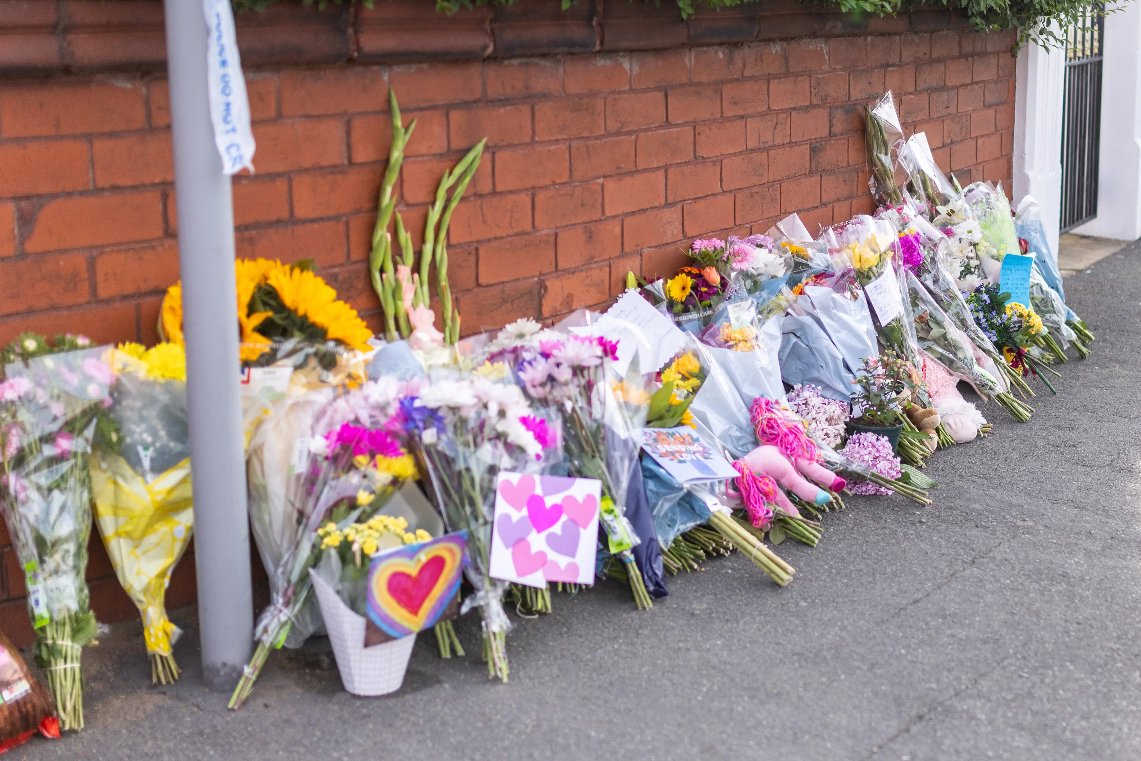 Flowers and condolences have been left by the local community. (PA)