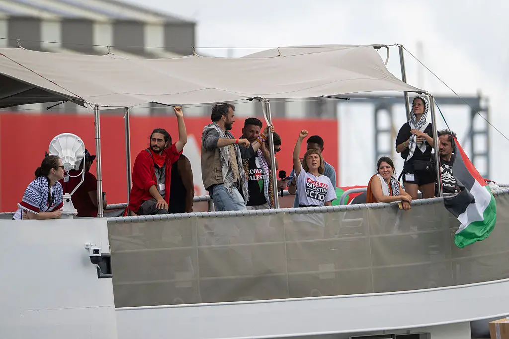 The group waved flags and chanted as the flotilla set sail (NurPhoto/Getty Images)