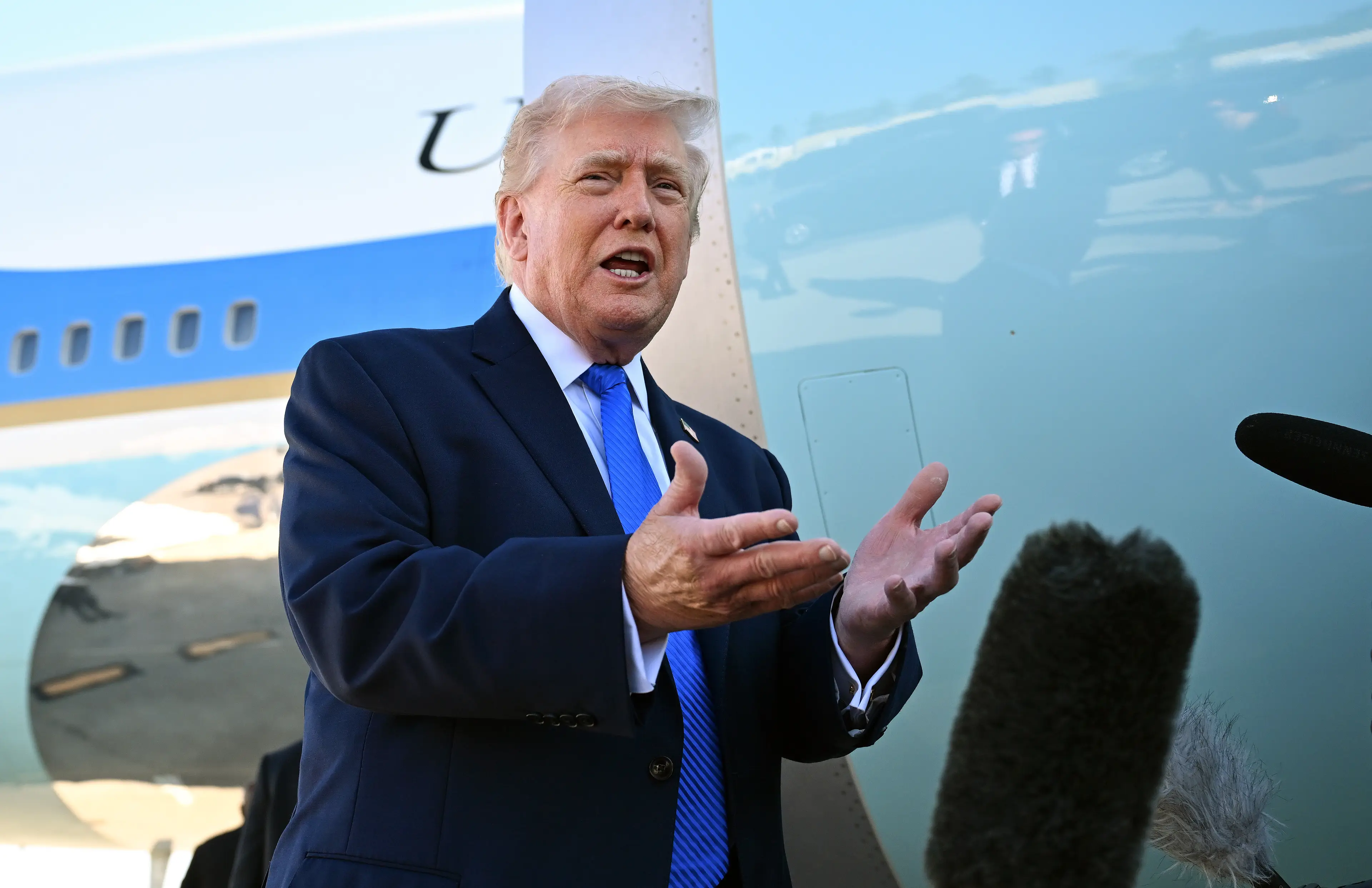 Trump announced the deployment of ICE agents into airports over the weekend (Roberto Schmidt/Getty Images)