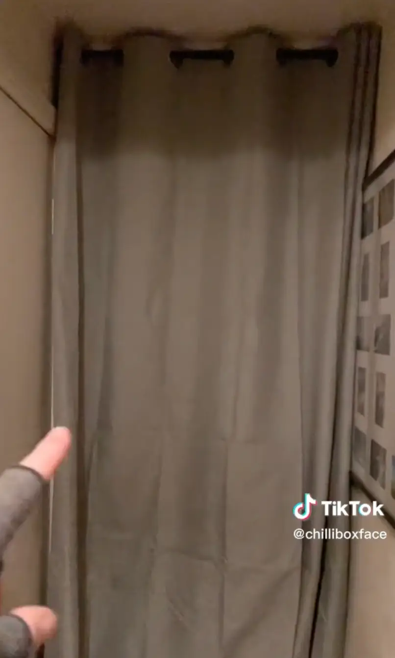 Hanging a curtain in front of your front door can help trap in the heat and prevent the cold from outside coming in.