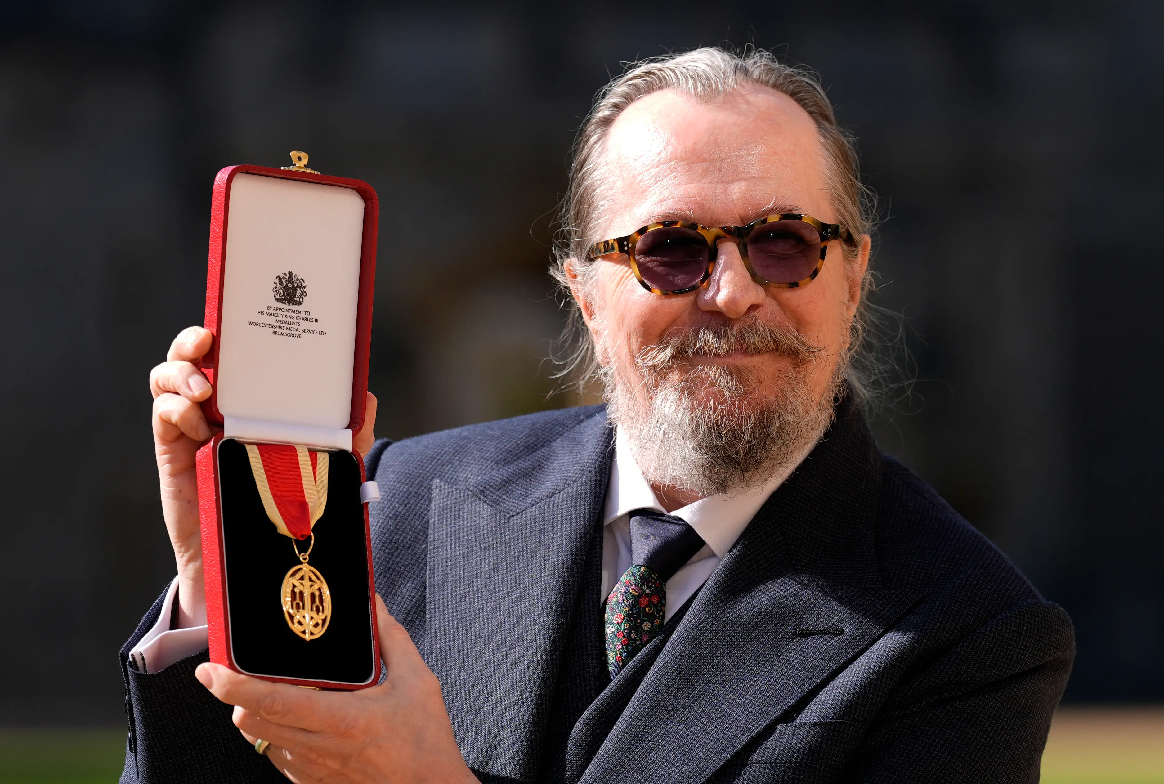 Sir Gary Oldman received a knighthood from Prince William on Tuesday (30 September) (PA)