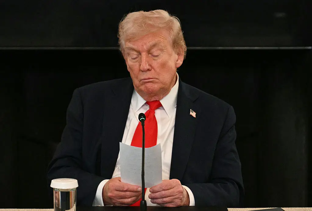 Trump got handed an elusive handwritten note during a press conference yesterday (JIM WATSON/Getty Images)