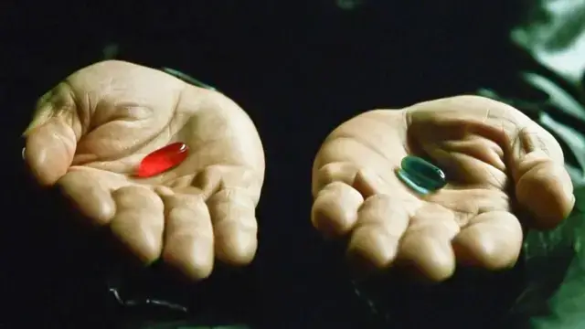 A character from the series explains the red pill and blue pill reference (Warner Bros.)