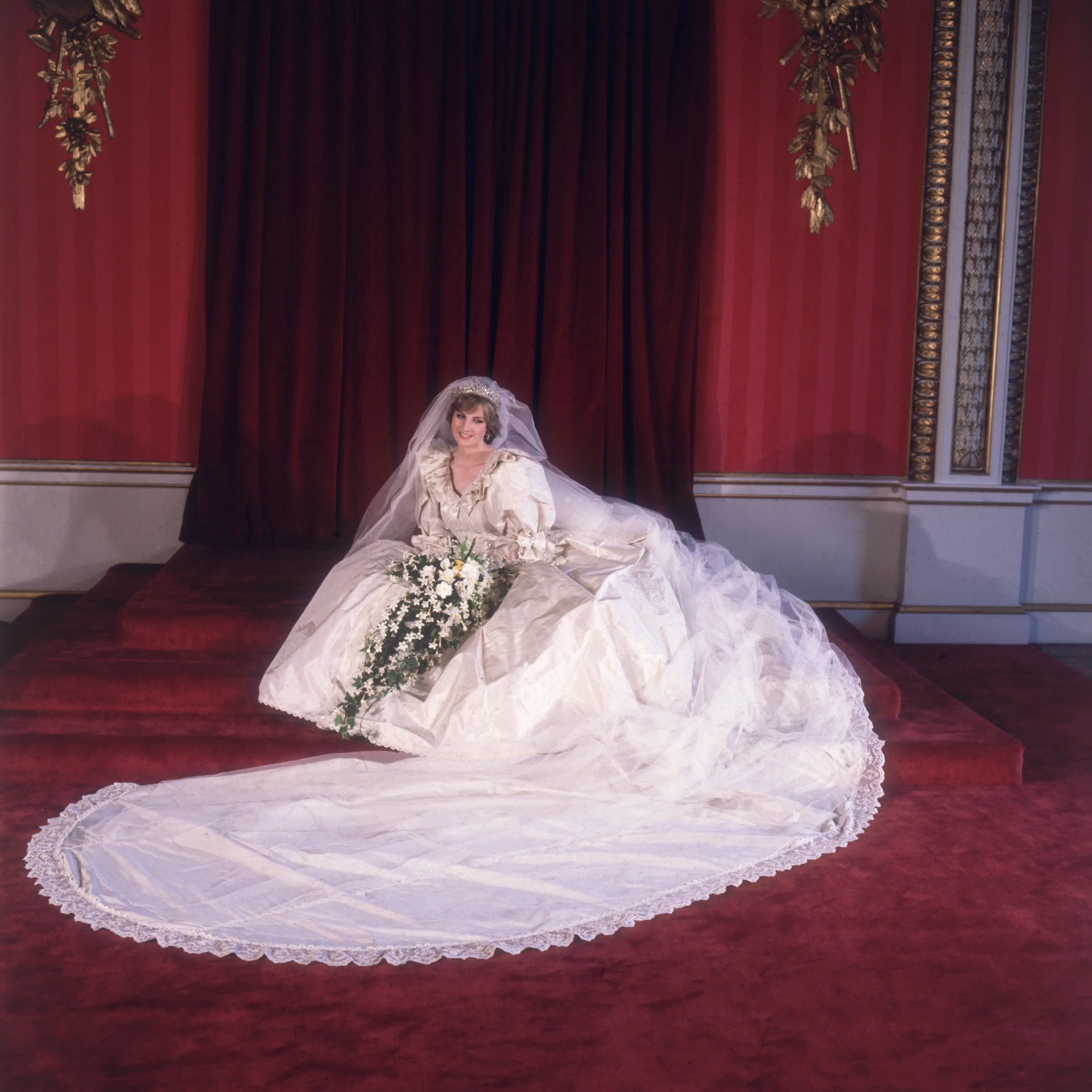 Diana wore an elaborate white gown (Fox Photos/Getty Images)