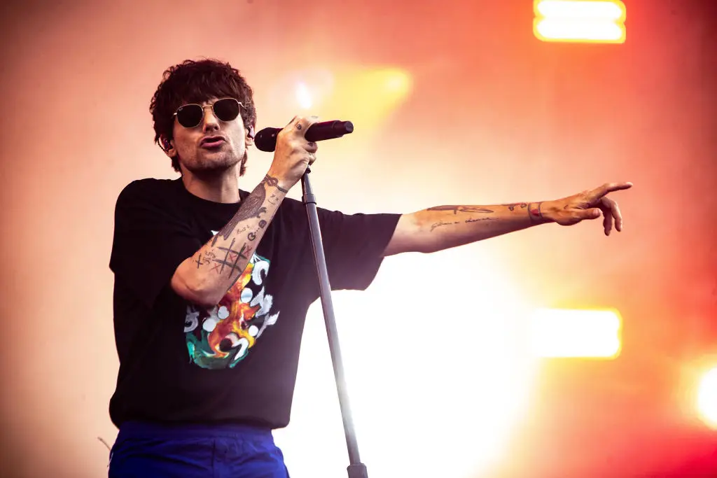 Louis Tomlinson decided to bring a flat-screen TV to Glastonbury Festival so he could catch the England game. (PAUL BERGEN/ANP/AFP via Getty Images)