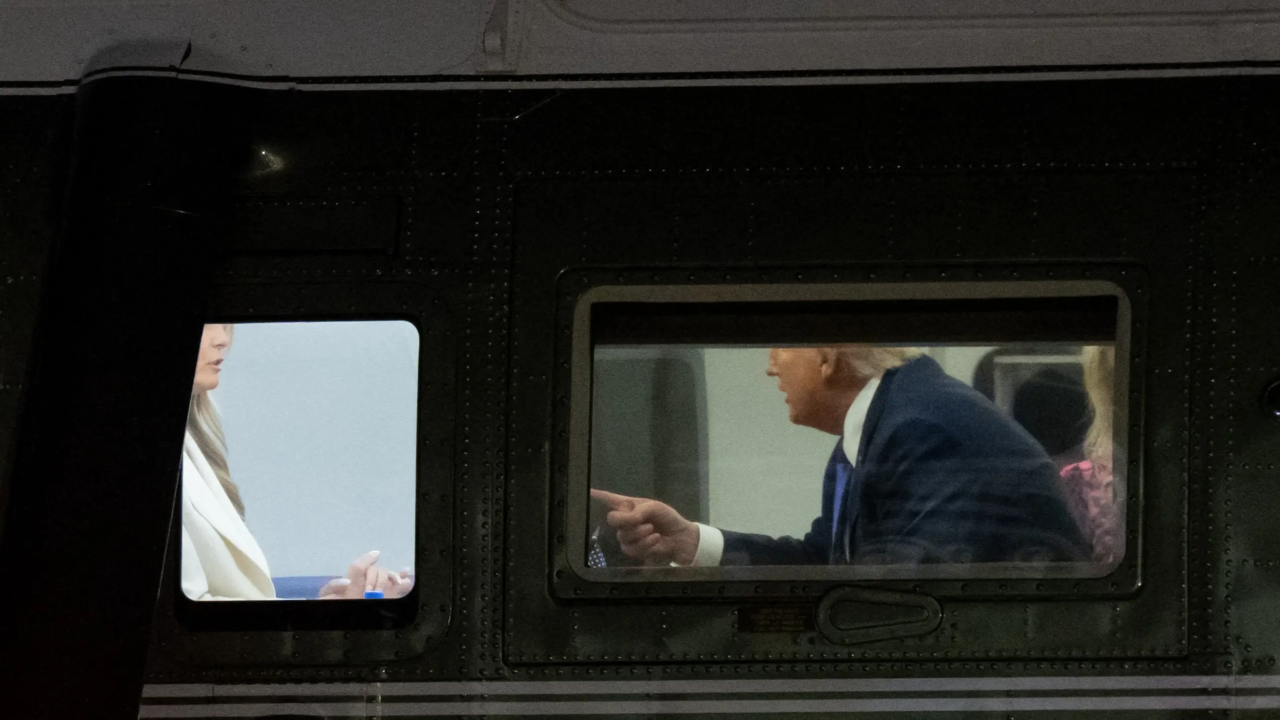 Donald and Melania Trump spotted having intense moment as they land back at White House