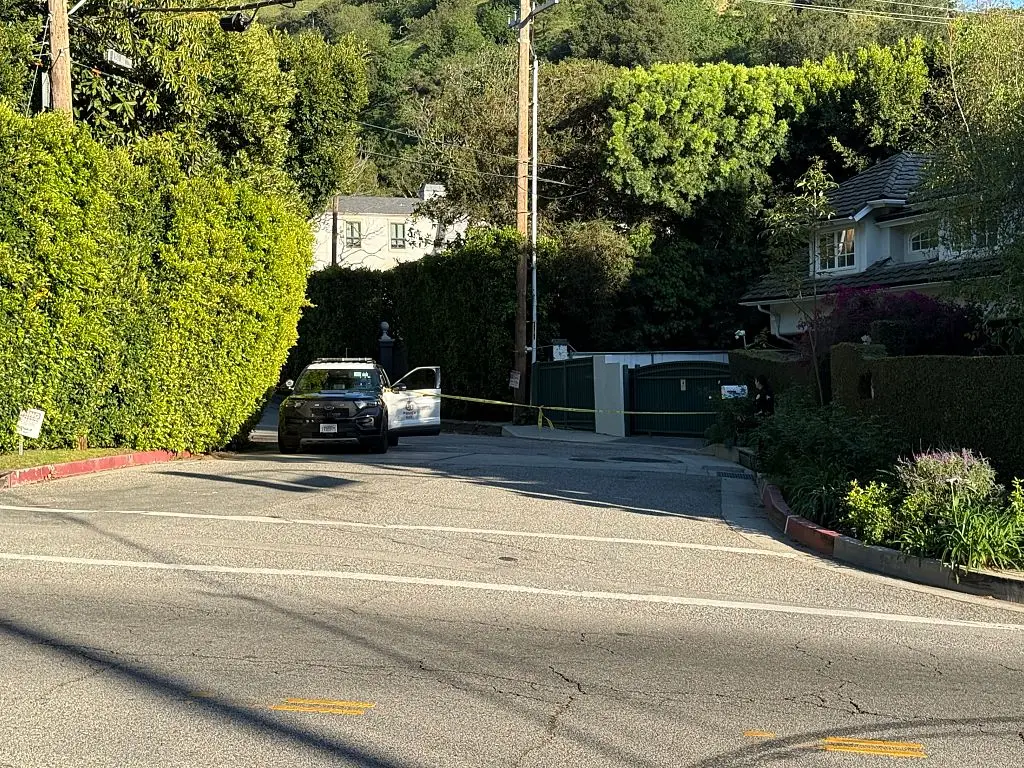 Police outside Rihanna's home on Sunday (MEGA/GC Images)