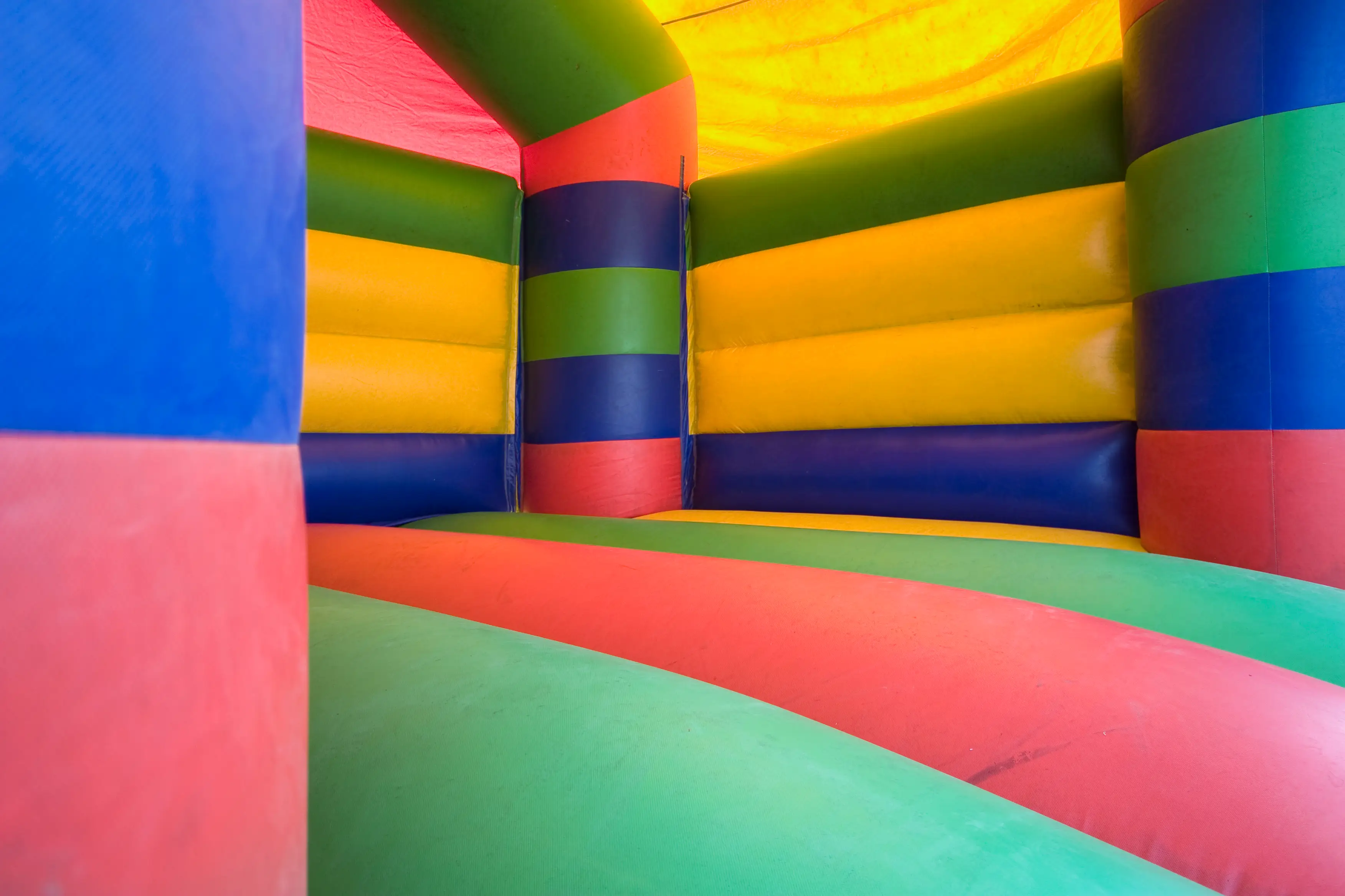 A strong gust of wind picked up a bounce house while children were playing inside. (Getty Stock Image)