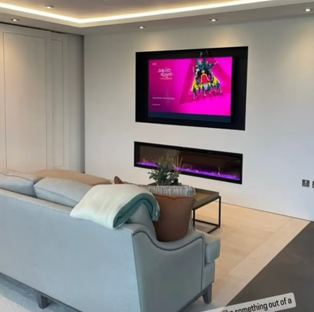 The couple showed off their flatscreen TV and accompanying fireplace display.