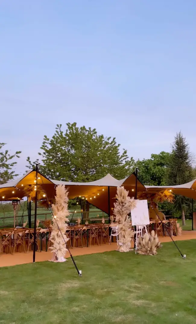 The breathtaking safari-themed shower took place under a marquee with rustic style long tables (