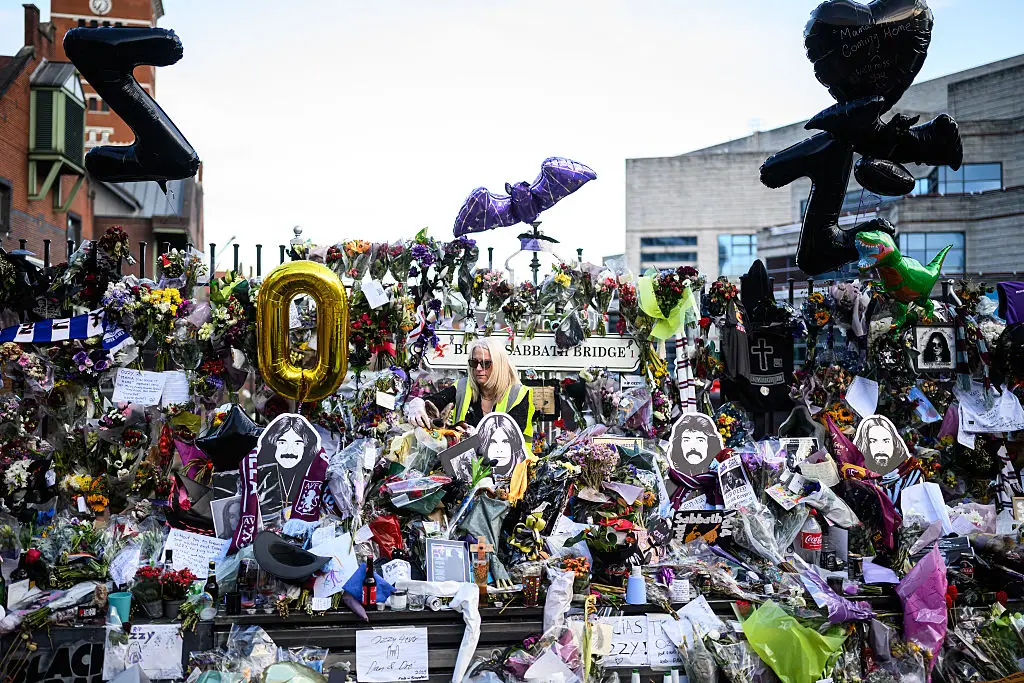 Fans placed tributes, flowers and balloons on Black Sabbath bridge and bench in Birmingham (Leon Neal / Getty Images)