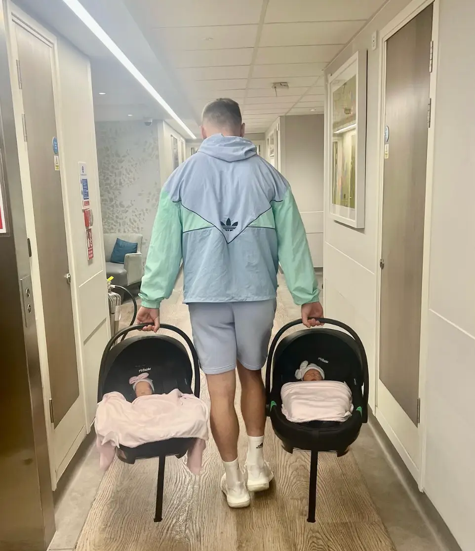 Jarrod leaving the hospital with the twins.