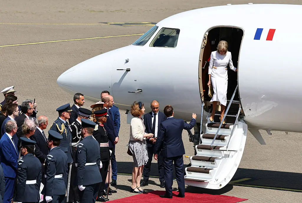 After touching down, Brigitte noticeably ignored her husband's hand for assistance whilst walking down the plane's steps (GONZALO FUENTES / Contributor / Getty Images)