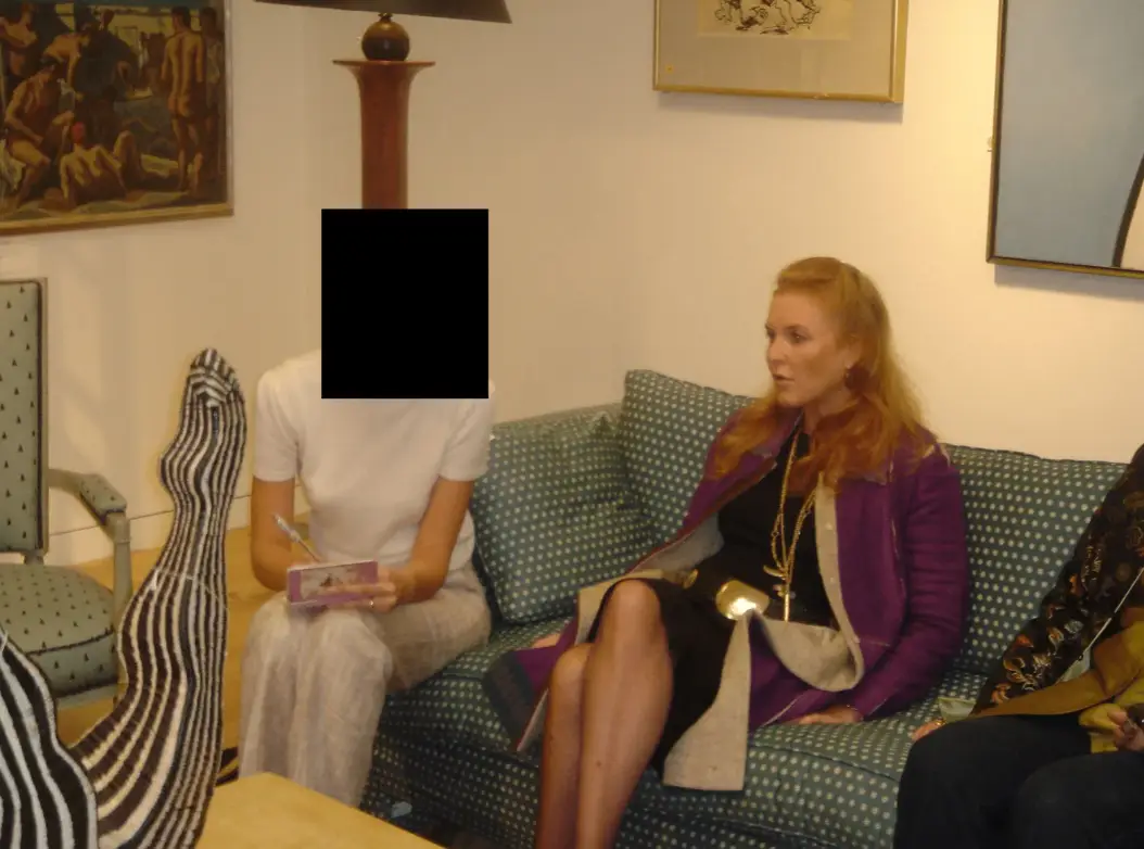 Sarah Ferguson is seen on a sofa with someone whose face has been redacted (Department of Justice)