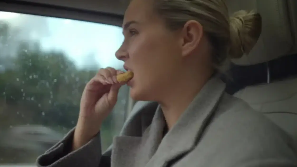 Molly-Mae Hague can be seen eating a chicken nugget in the car (Amazon Prime Video)