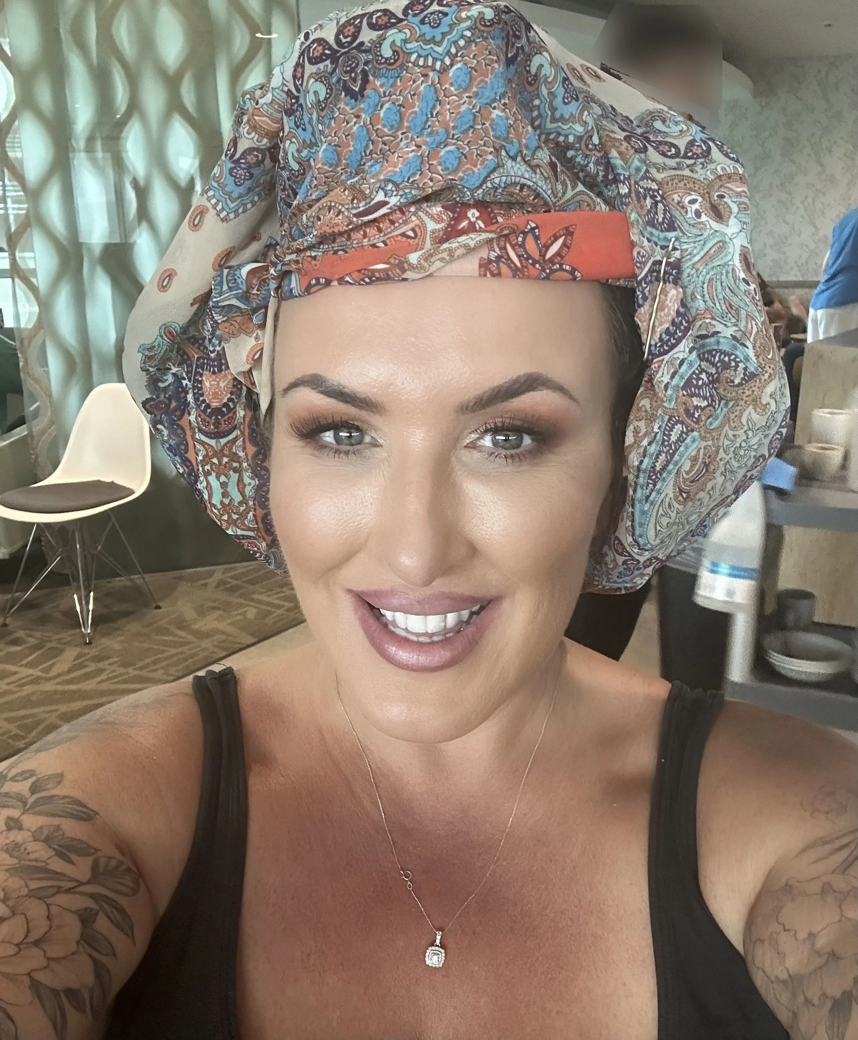 She tried to conceal the rollers with a scarf.