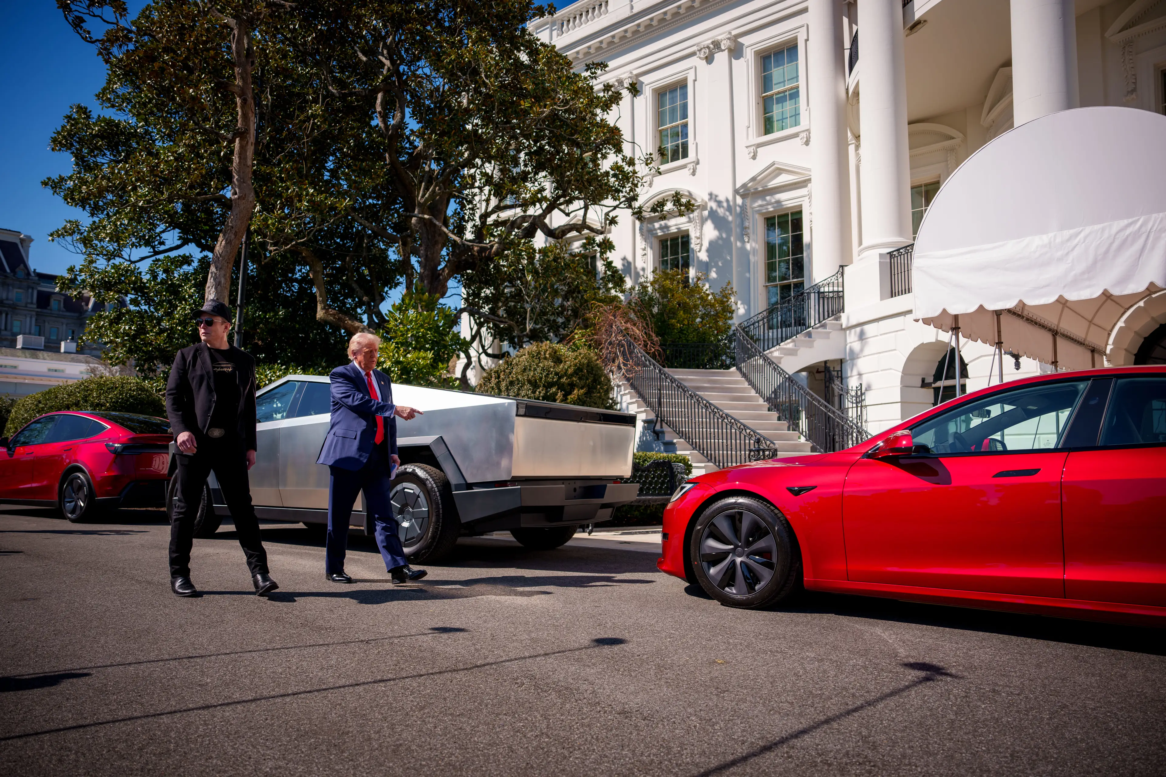 Critics have branded the Tesla car placement outside the White House as 'an ad' and 'illegal' (Andrew Harnik/Getty Images)