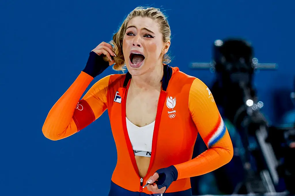 While celebrating, she unzipped her top to reveal a Nike sports bra underneath (DeFodi Images/Getty Images)