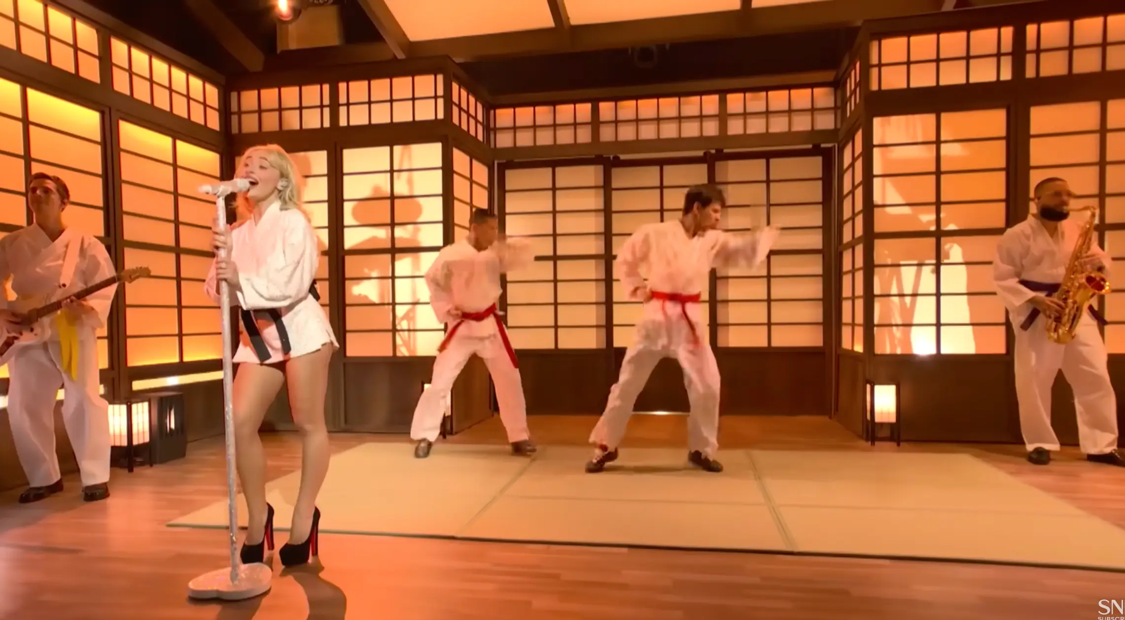 The backlash comes from her backing performers wearing shoes while on the tatami mats (SNL)