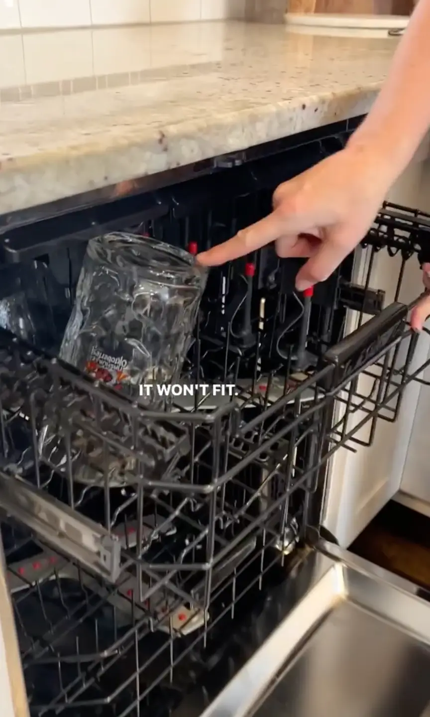 The tall glass wouldn't fit on the top shelf.