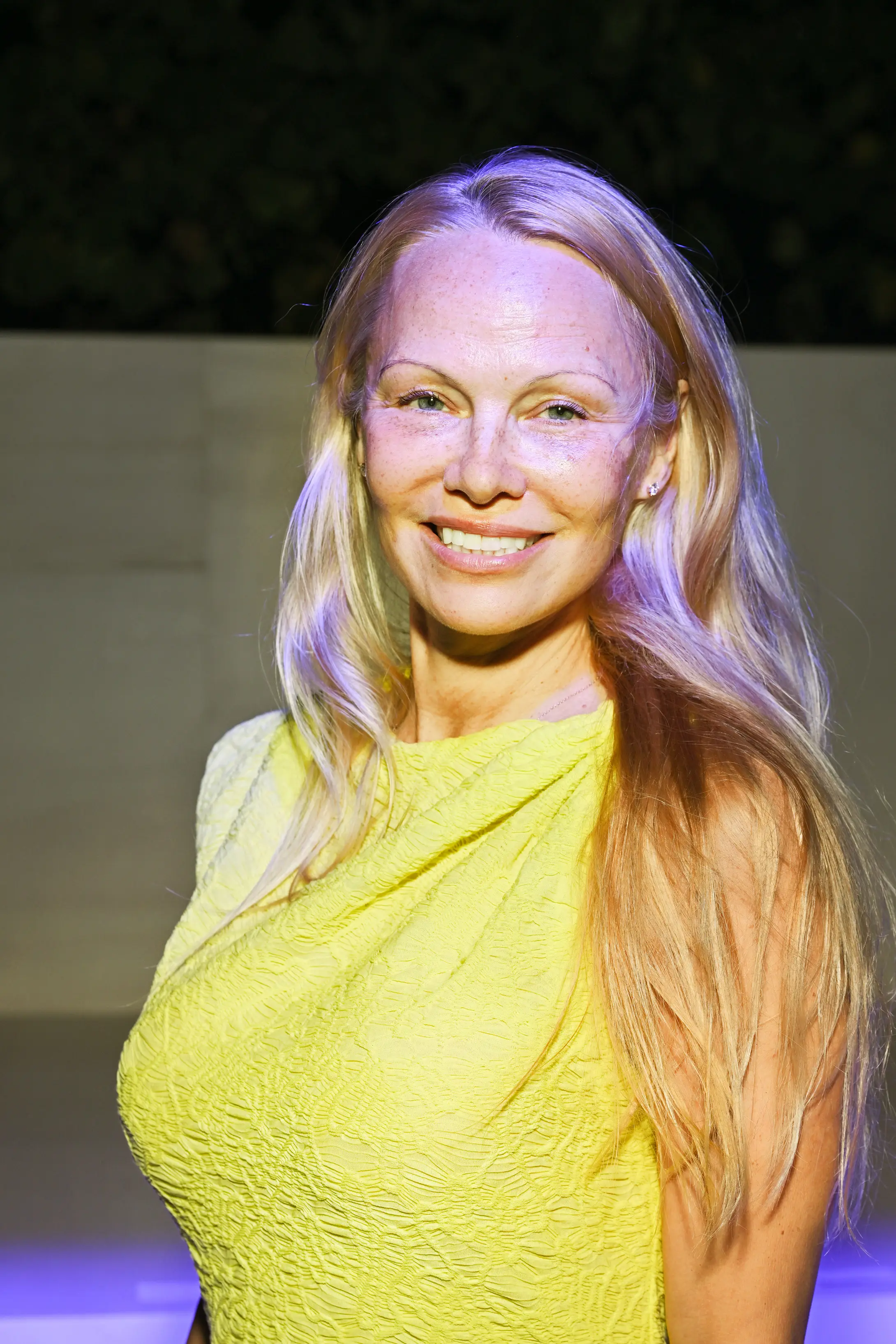 Pamela Anderson went makeup-free at Paris Fashion Week.