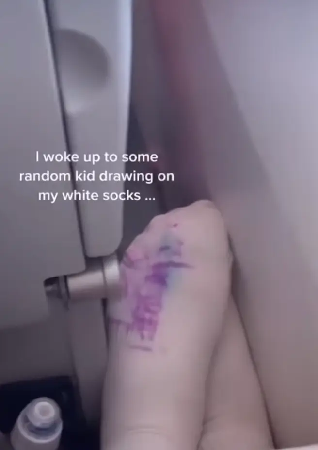 People said the woman shouldn't have had her feet on the armrest.