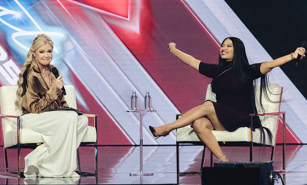 Turning Point USA CEO Erika Kirk and Minaj during Turning Point's annual AmericaFest conference in December 2025 (OLIVIER TOURON / Contributor / Getty Images)