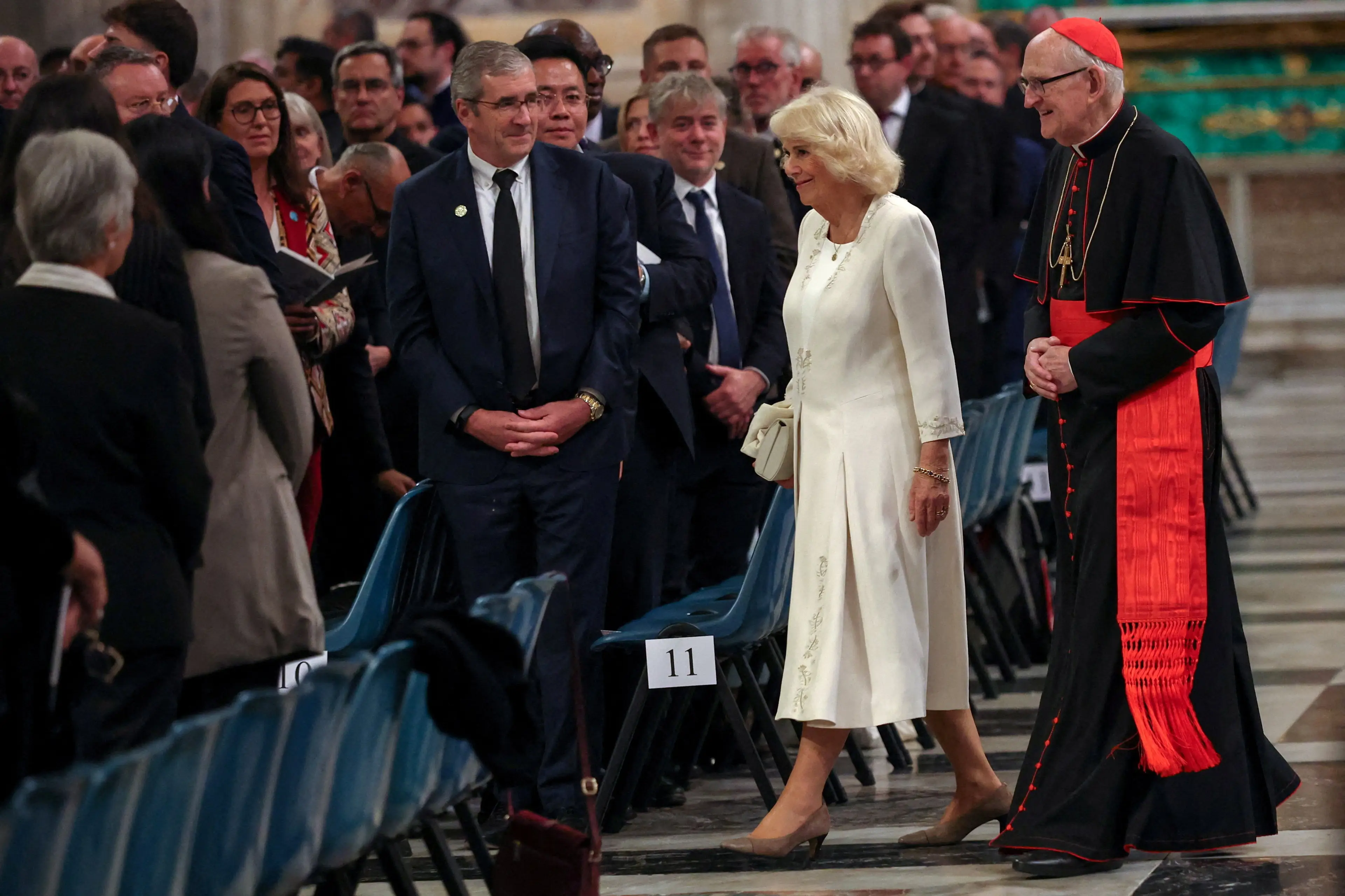 Queen Camilla has been criticised for wearing white (PA)