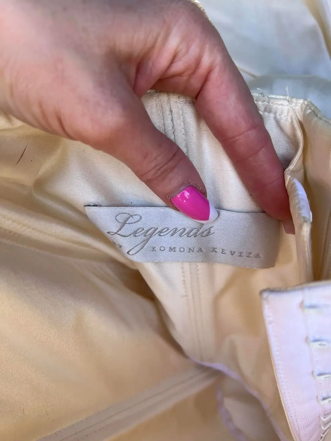 The dress is an authentic designer piece.