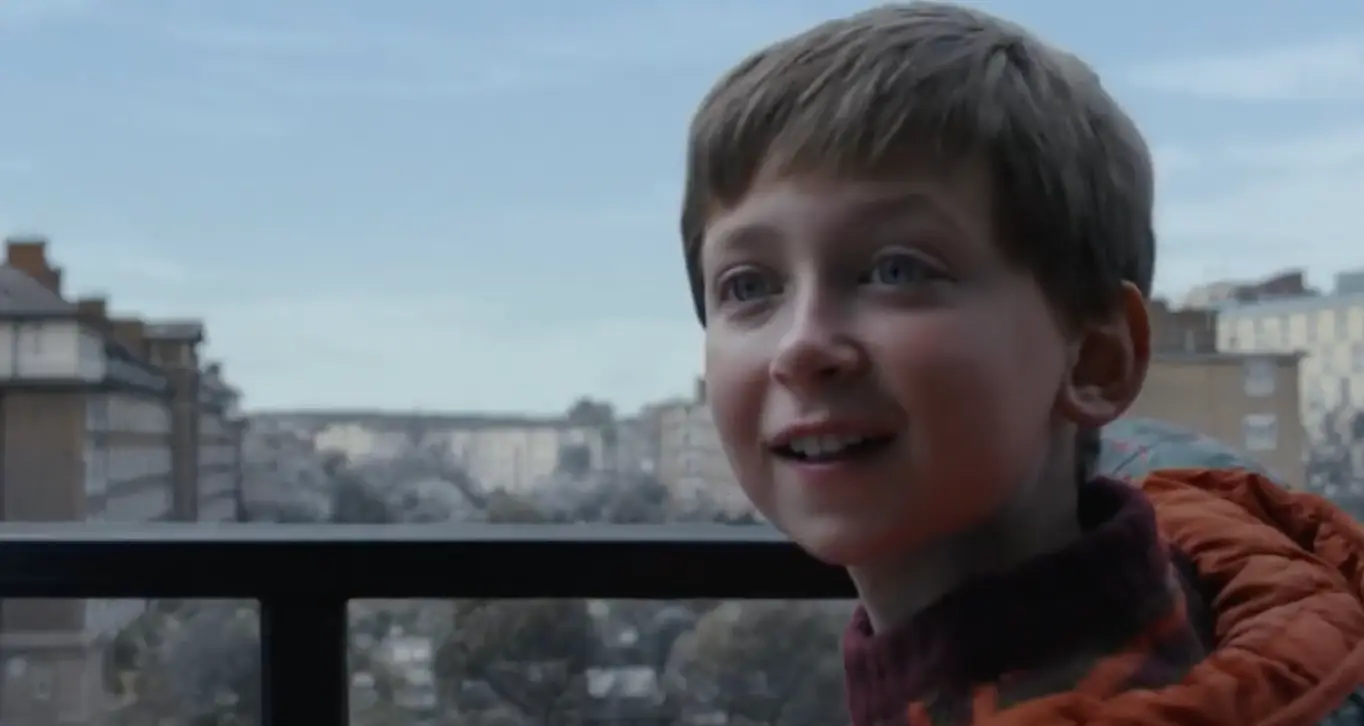 The little lad writes his list for Santa.