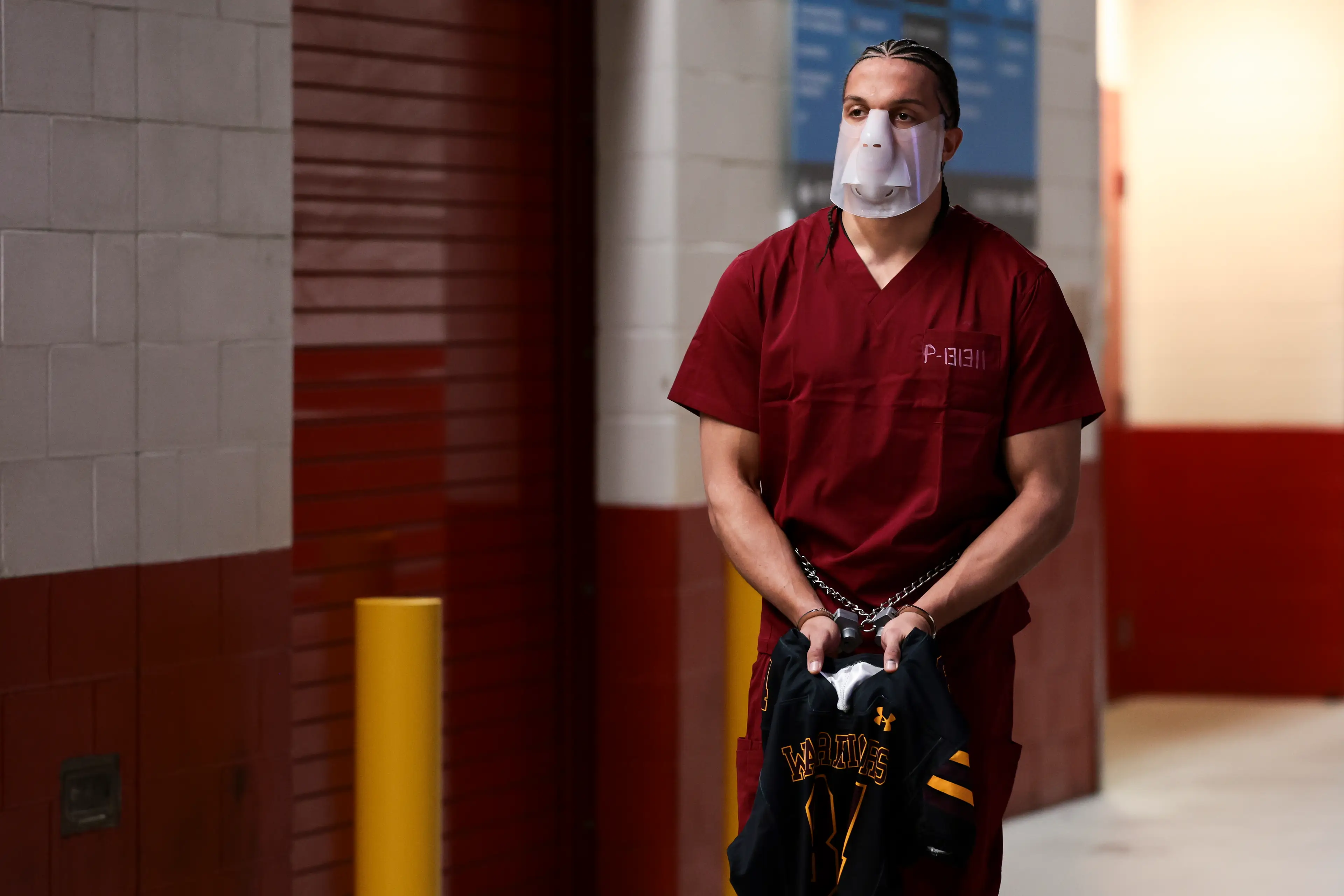 New England Patriots star Mack Hollins donned a prison uniform complete with a mask and handcuffs ahead of the Super Bowl yesterday (Kathryn Riley/Getty Images)