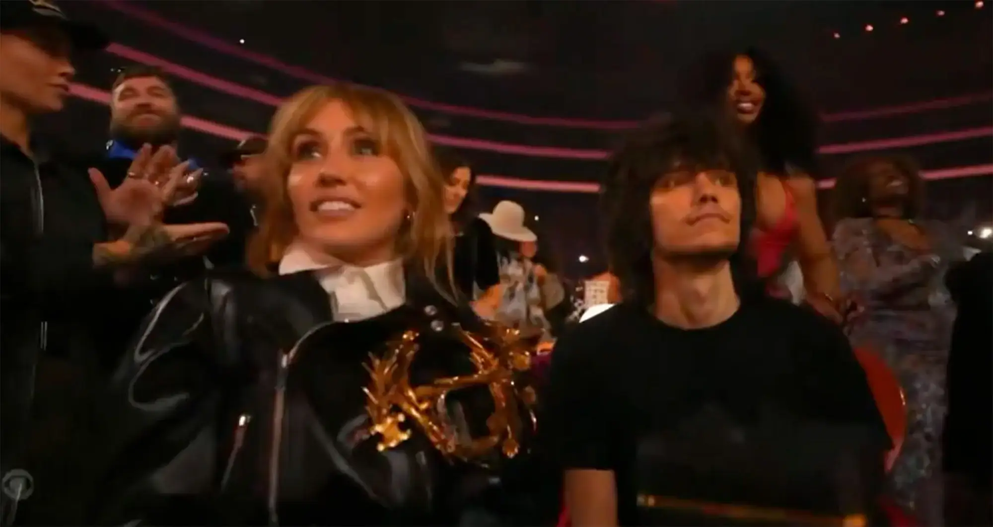 Miley remained seated during Gaga's big moment (CBS)