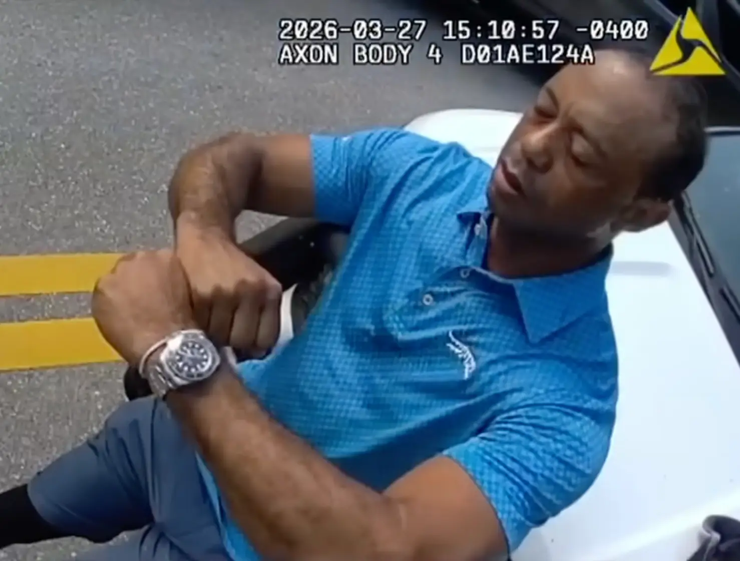 Tiger Woods is seen in the footage in the wake of rolling his SUV (Martin County Sheriff’s Office)