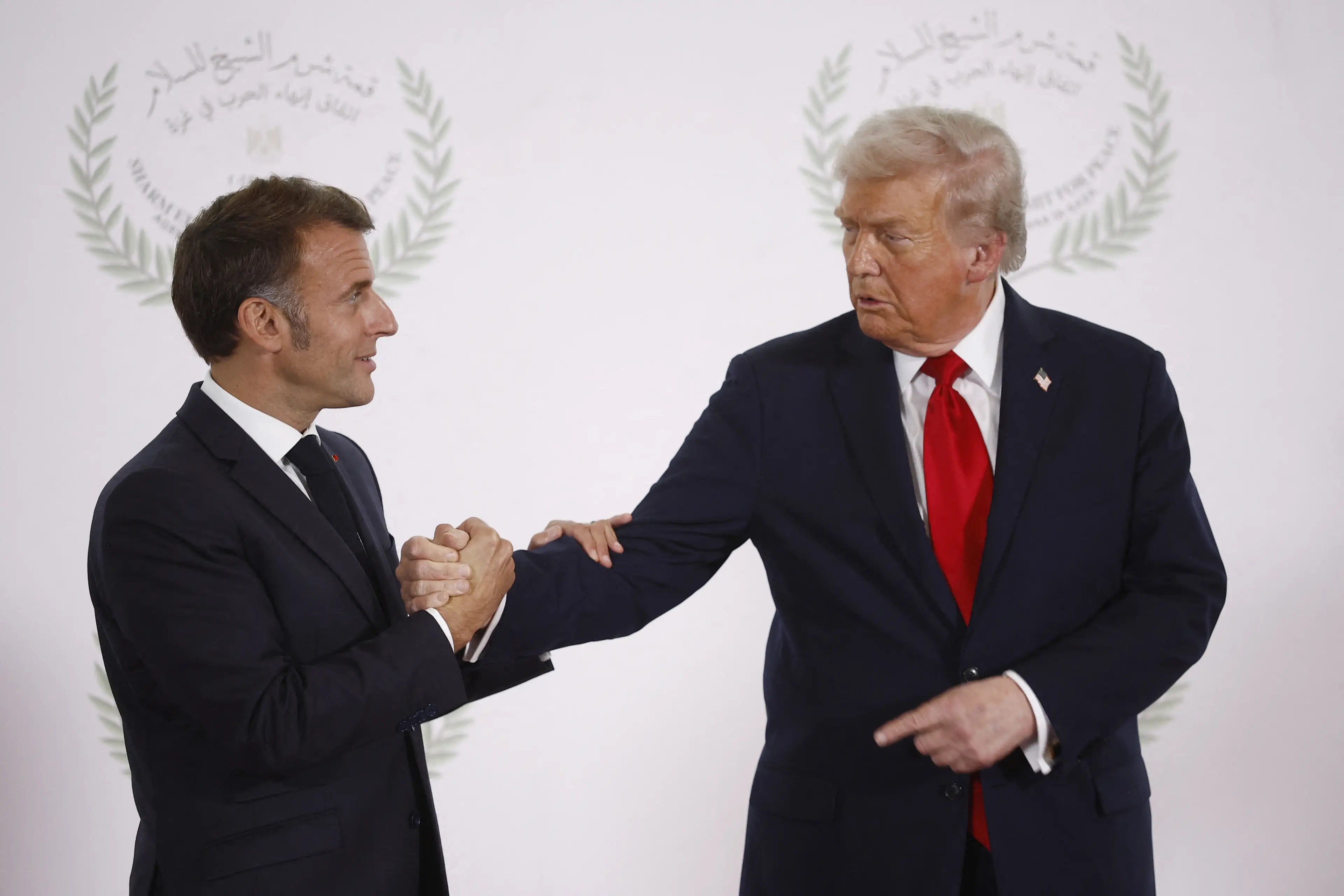 Trump and Macron's very tense handshake has prompted speculation online (YOAN VALAT/POOL/AFP via Getty Images)