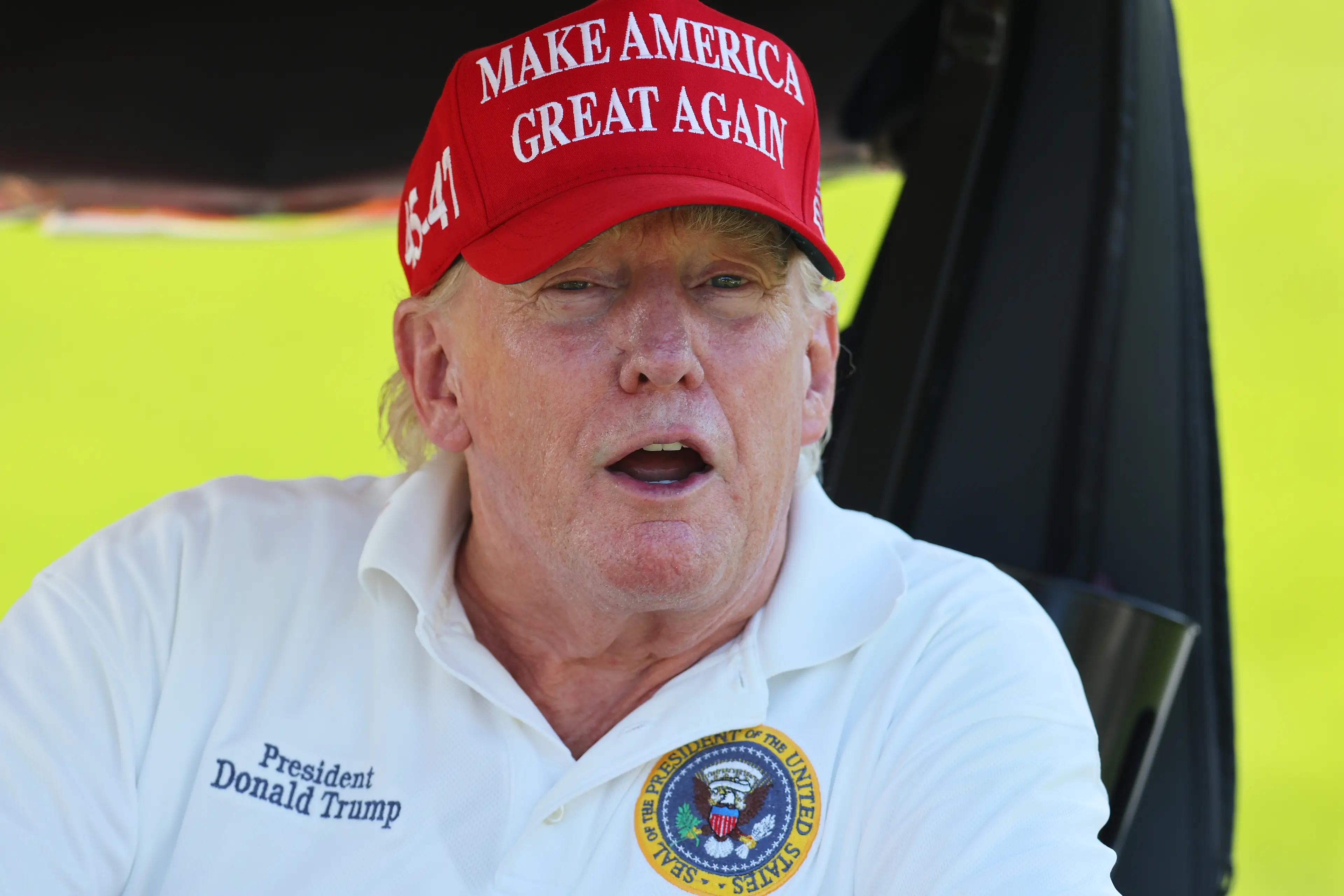 One of Donald Trump's golf caddies once put a man in a 'choke hold' after he spoke his mind on the president (Mike Stobe/Getty Images)