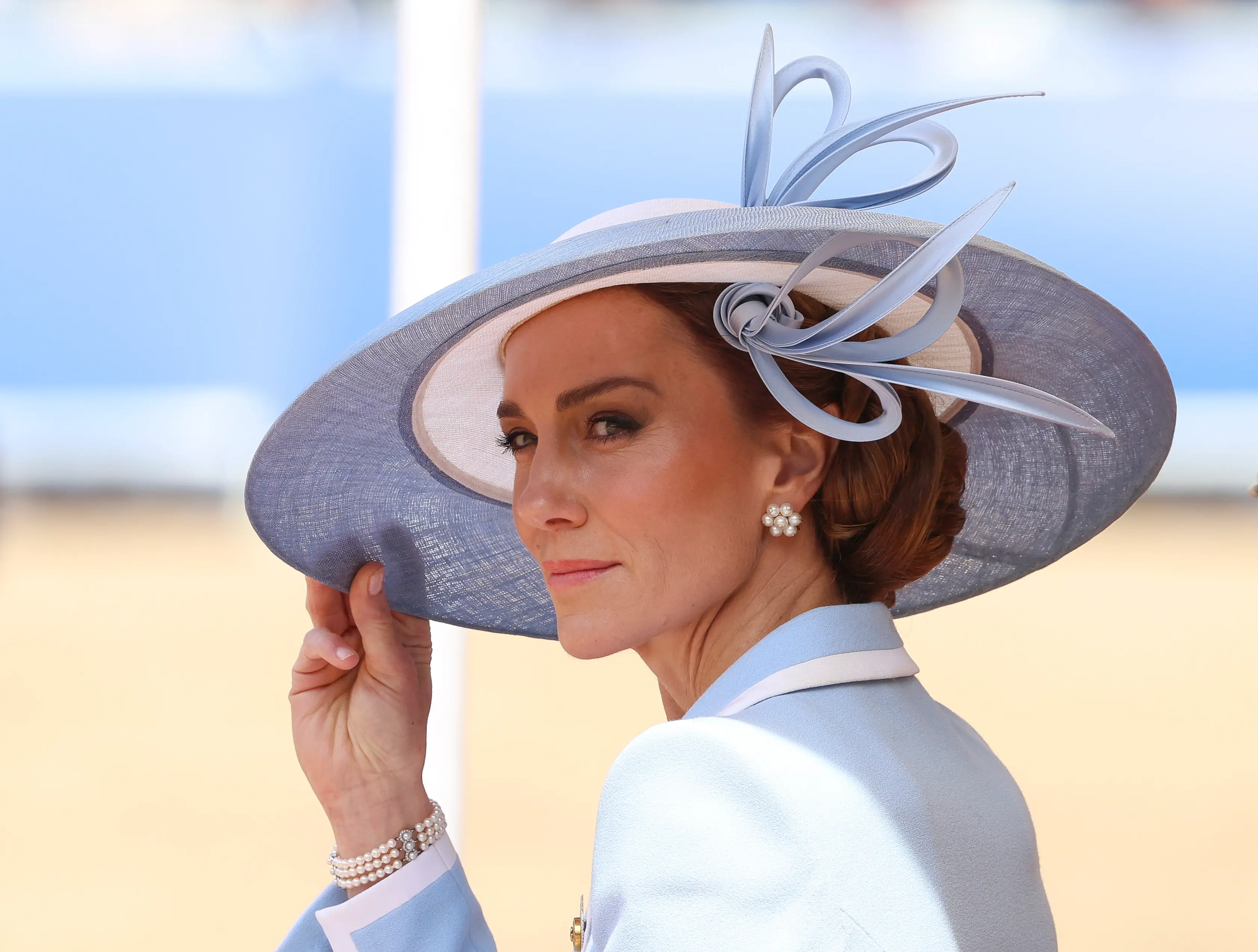The Princess paired the coat dress with a matching hat and white heels (Mike Marsland/WireImage)